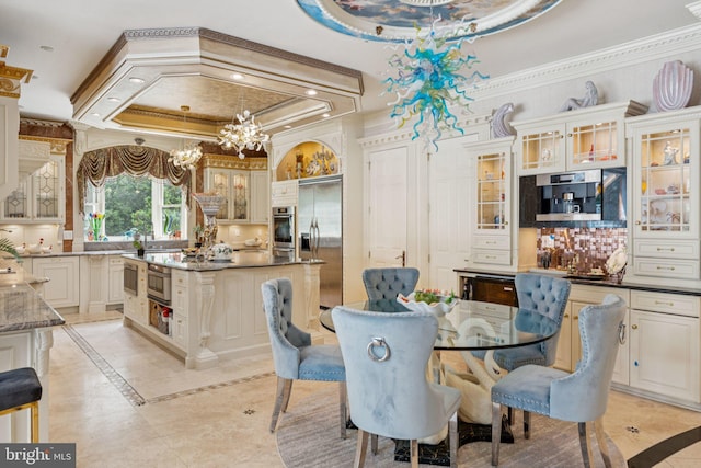 423 Seneca Rd, Great Falls, VA 22066 - dining area featuring inlaid floor details, a tray ceiling, ornamental molding, a chandelier, and recessed lighting