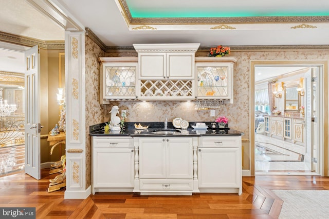 423 Seneca Rd, Great Falls, VA 22066 - indoor wet bar with wallpapered walls, light wood-style floors, and ornamental molding