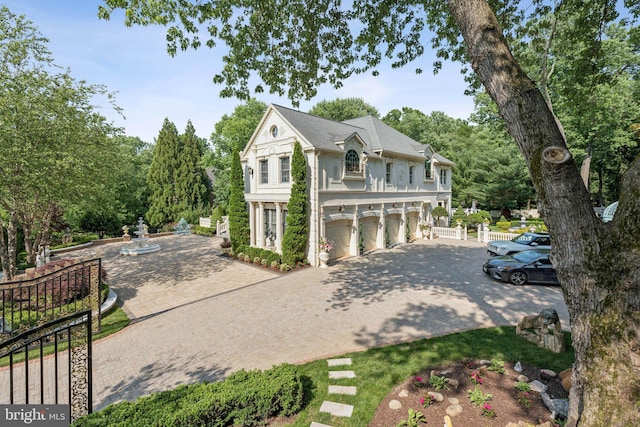 423 Seneca Rd, Great Falls, VA 22066 - view of front facade with driveway, an attached garage, and view of scattered trees