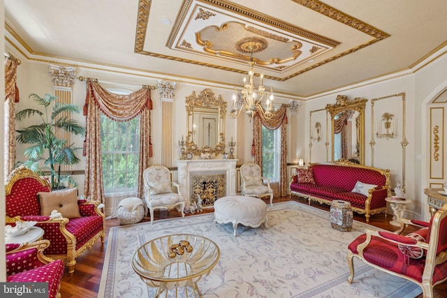 423 Seneca Rd, Great Falls, VA 22066 - sitting room featuring a chandelier, a raised ceiling, wood finished floors, crown molding, and a fireplace
