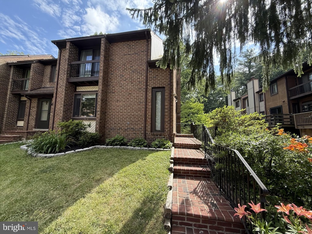 5818 Jacksons Oak Ct, Burke, VA 22015 - view of front facade featuring brick siding and a front yard