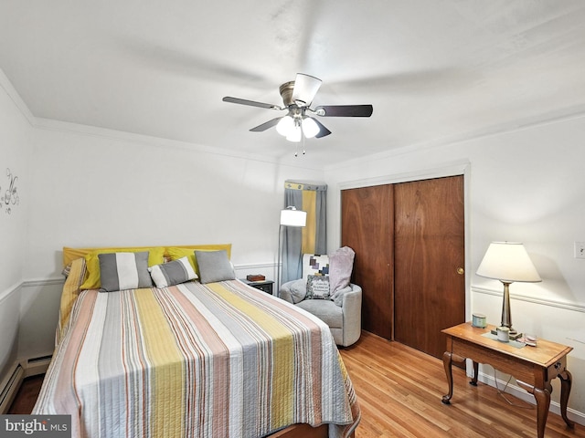 2205 Culpeper Dr, Woodbridge, VA 22191 - bedroom with baseboard heating, wood finished floors, a closet, and ceiling fan