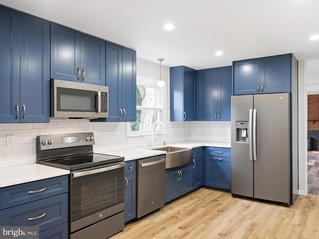 110 Wembley Rd, Wilmington, DE 19808 - kitchen with appliances with stainless steel finishes, blue cabinets, light countertops, and recessed lighting