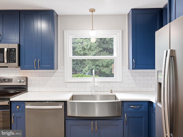 110 Wembley Rd, Wilmington, DE 19808 - kitchen with appliances with stainless steel finishes, blue cabinetry, backsplash, and light countertops
