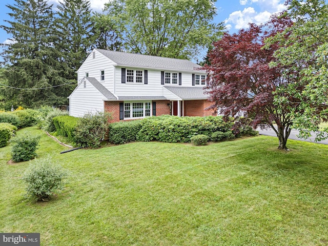 110 Wembley Rd, Wilmington, DE 19808 - view of front of home with brick siding, a front lawn, and roof with shingles