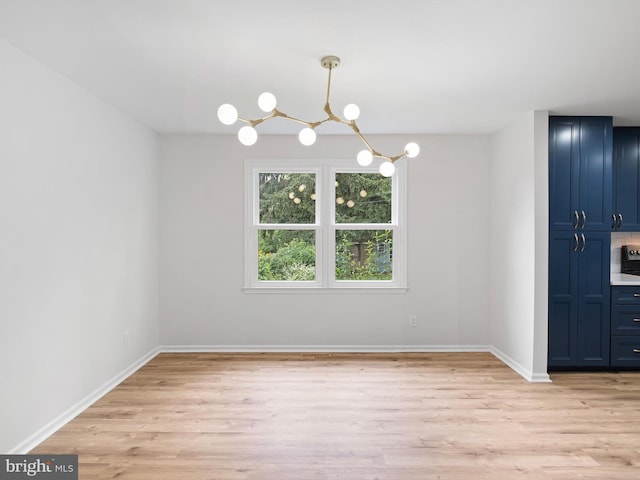 110 Wembley Rd, Wilmington, DE 19808 - unfurnished dining area with a chandelier and light wood-style floors