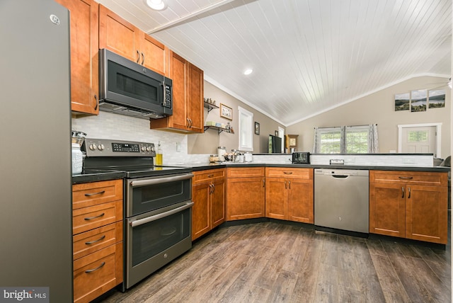 108 W Center St, Kitzmiller, MD 21538 - kitchen with appliances with stainless steel finishes, vaulted ceiling, dark wood finished floors, a peninsula, and dark countertops