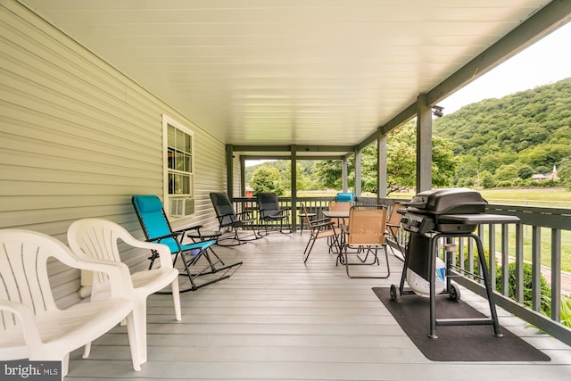 108 W Center St, Kitzmiller, MD 21538 - porch with area for grilling, outdoor dining space, and a forest view