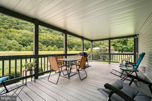 108 W Center St, Kitzmiller, MD 21538 - deck with a wooded view, outdoor dining area, and a yard