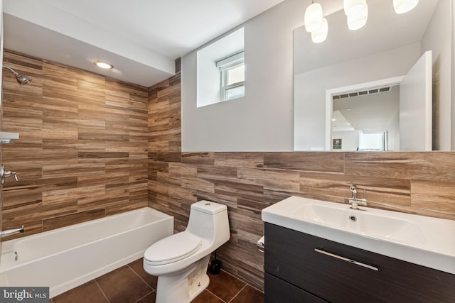 2228 Carpenter St, Philadelphia, PA 19146 - bathroom with vanity, tile walls, tile patterned flooring, and washtub / shower combination