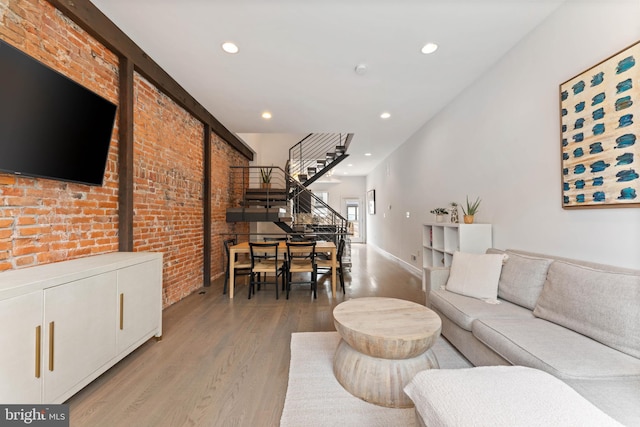 2228 Carpenter St, Philadelphia, PA 19146 - living area with light wood-style floors, stairs, recessed lighting, and brick wall