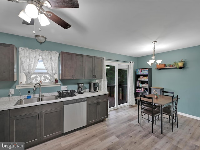 418 High St, Schuylkill Haven, PA 17972 - kitchen featuring stainless steel dishwasher, light countertops, light wood finished floors, ceiling fan, and decorative light fixtures