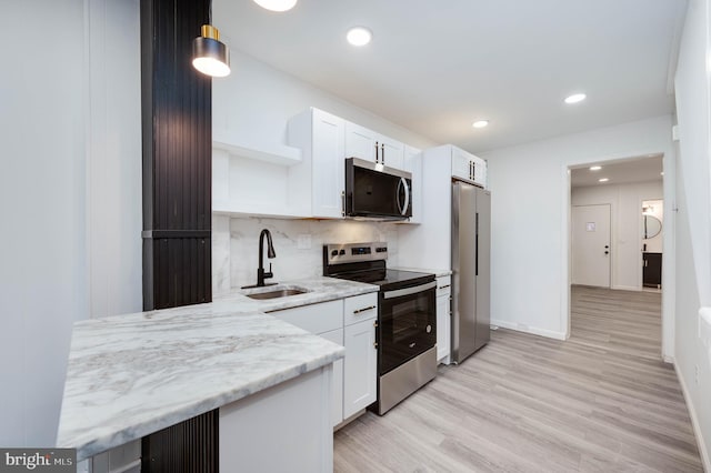 1354 Green St, Reading, PA 19604 - kitchen featuring stainless steel appliances, open shelves, white cabinets, tasteful backsplash, and recessed lighting