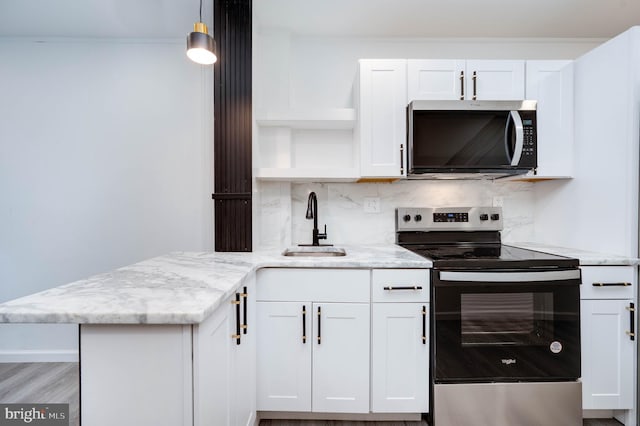 1354 Green St, Reading, PA 19604 - kitchen featuring open shelves, appliances with stainless steel finishes, white cabinets, a peninsula, and backsplash