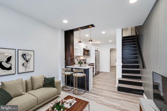 1354 Green St, Reading, PA 19604 - living room featuring stairs, light wood-style flooring, and recessed lighting