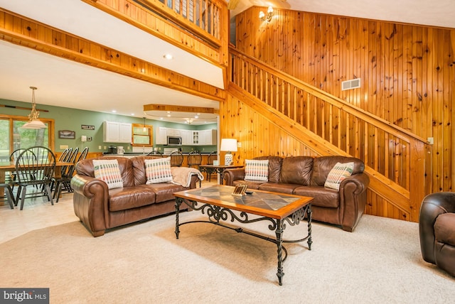 60 Barbaras Way, Mc Henry, MD 21541 - living area with wood walls, light colored carpet, and stairway