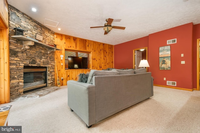 60 Barbaras Way, Mc Henry, MD 21541 - living area with a fireplace, ceiling fan, carpet flooring, wood walls, and attic access