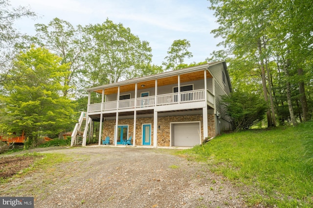 60 Barbaras Way, Mc Henry, MD 21541 - view of front of house with stairs, a garage, driveway, stone siding, and a wooden deck
