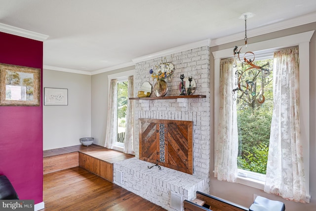 8615 Acorn Cir, Vienna, VA 22180 - living room featuring wood finished floors, crown molding, and a brick fireplace