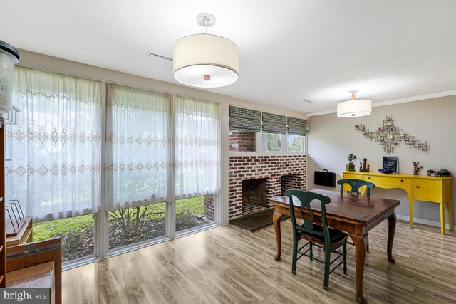 8615 Acorn Cir, Vienna, VA 22180 - dining room featuring wood finished floors and a fireplace