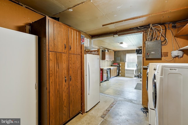 8615 Acorn Cir, Vienna, VA 22180 - kitchen featuring freestanding refrigerator, electric panel, concrete flooring, brown cabinets, and washing machine and dryer
