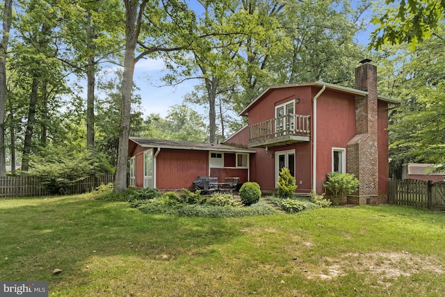 8615 Acorn Cir, Vienna, VA 22180 - rear view of house featuring a balcony, a chimney, a fenced backyard, and french doors