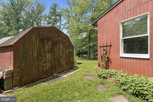 8615 Acorn Cir, Vienna, VA 22180 - view of home's exterior with a storage shed and a lawn