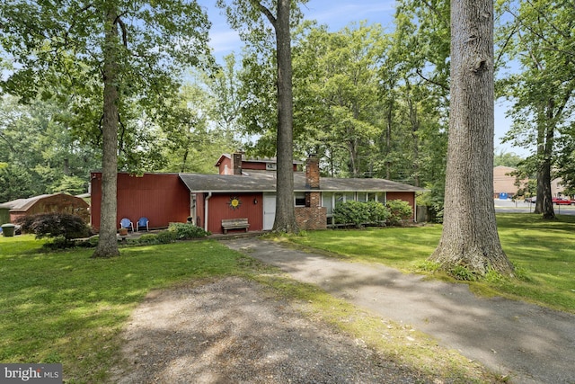 8615 Acorn Cir, Vienna, VA 22180 - view of front facade featuring a chimney and a front yard