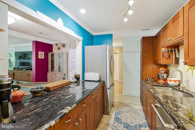 8615 Acorn Cir, Vienna, VA 22180 - kitchen with brown cabinetry, appliances with stainless steel finishes, dark stone counters, and crown molding