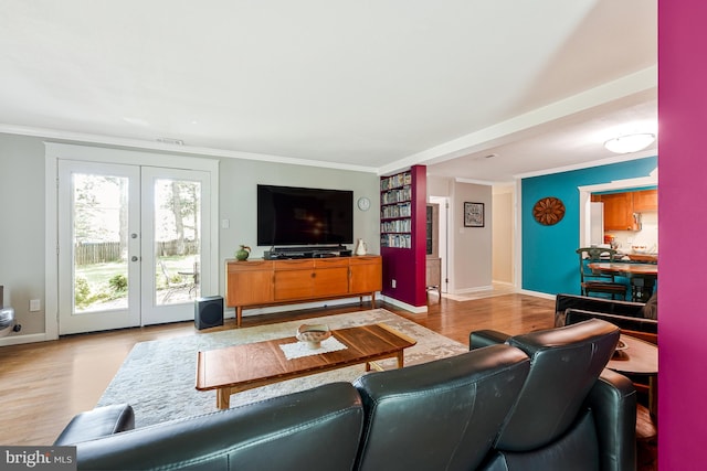 8615 Acorn Cir, Vienna, VA 22180 - living area with wood finished floors, french doors, and crown molding
