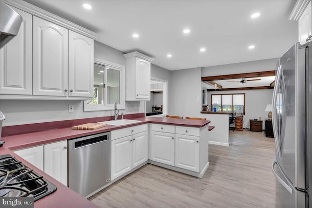 19 Oniontown Rd, Medford, NJ 08055 - kitchen with appliances with stainless steel finishes, a peninsula, white cabinets, light wood finished floors, and recessed lighting