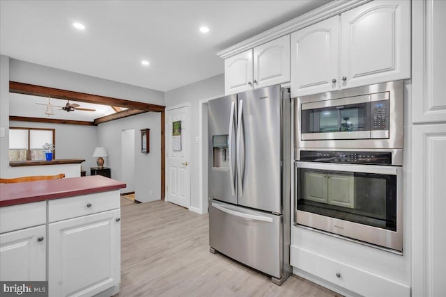 19 Oniontown Rd, Medford, NJ 08055 - kitchen with appliances with stainless steel finishes, white cabinets, light wood finished floors, recessed lighting, and a ceiling fan
