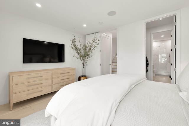 146 S St NW Unit B, Washington, DC 20001 - bedroom featuring light wood finished floors, recessed lighting, and ensuite bath