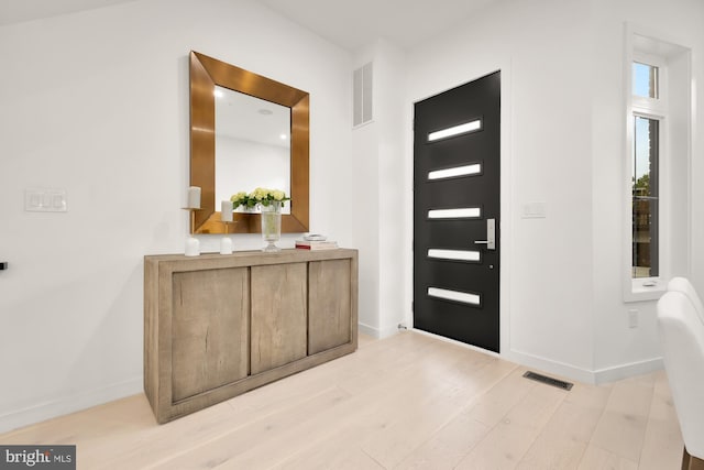 146 S St NW Unit B, Washington, DC 20001 - foyer entrance with light wood-style flooring and baseboards
