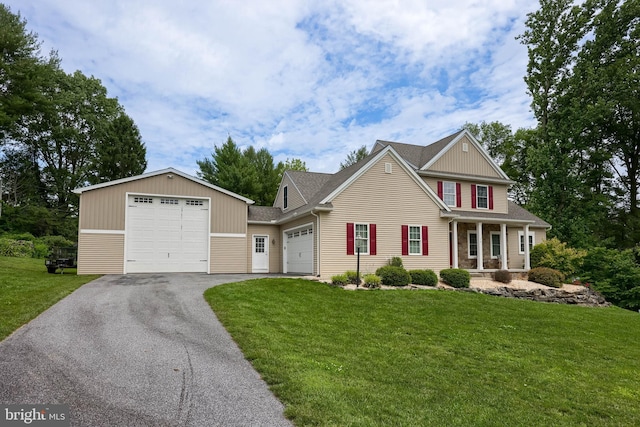36 Elm Ct, Lancaster, PA 17603 - view of front of home featuring a front lawn, asphalt driveway, a porch, and a garage