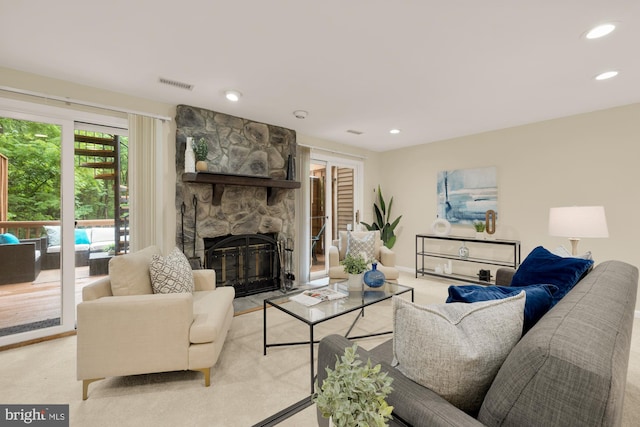 1937 Hickory Hill Ln, Silver Spring, MD 20906 - living area featuring light colored carpet, a stone fireplace, and recessed lighting