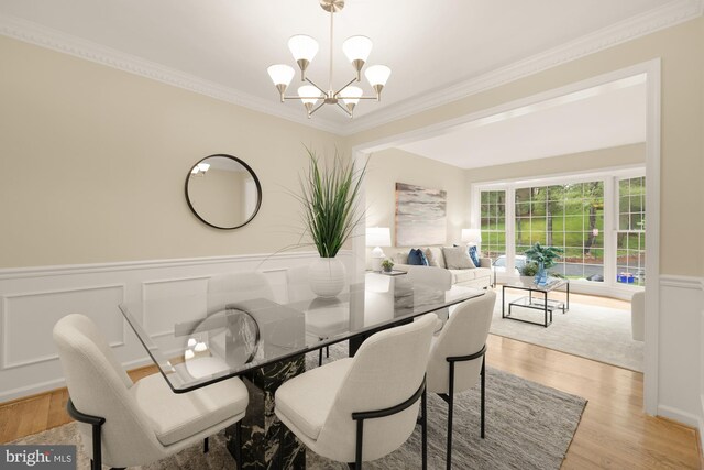 1937 Hickory Hill Ln, Silver Spring, MD 20906 - dining room featuring wainscoting, a chandelier, ornamental molding, light wood-style floors, and a decorative wall