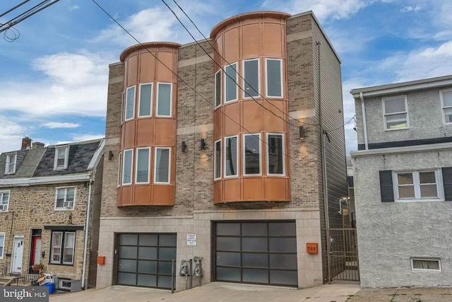 144 Levering St, Philadelphia, PA 19127 - view of building exterior with driveway and an attached garage