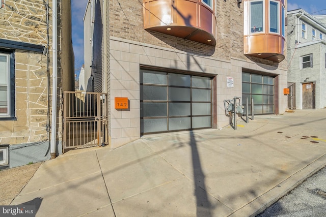 144 Levering St, Philadelphia, PA 19127 - view of building exterior featuring a garage and concrete driveway