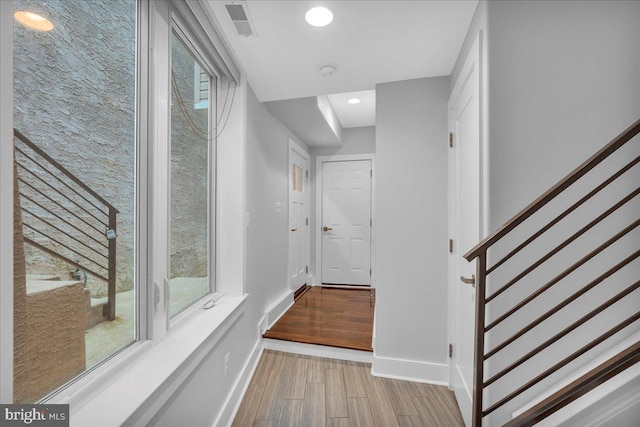 144 Levering St, Philadelphia, PA 19127 - hall featuring stairway, wood finished floors, and recessed lighting