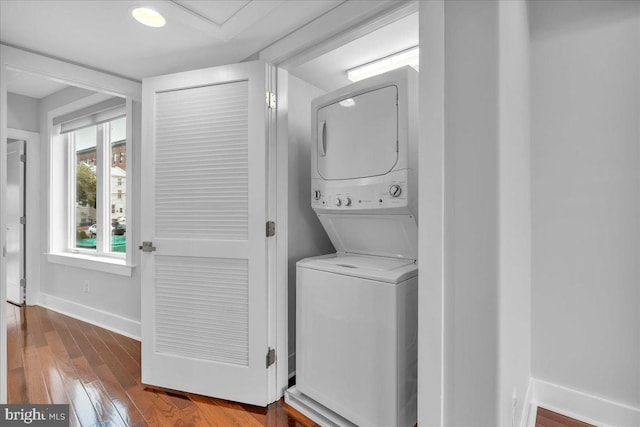 144 Levering St, Philadelphia, PA 19127 - washroom featuring estacked washer and dryer and wood finished floors