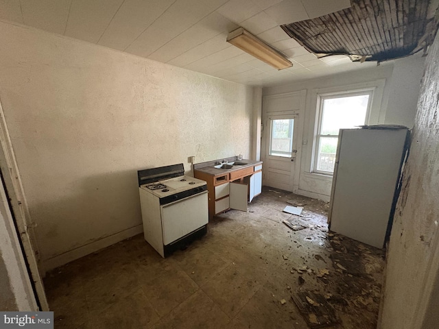 418 Middle Ave, Wilmerding, PA 15148 - kitchen with white appliances and a textured wall