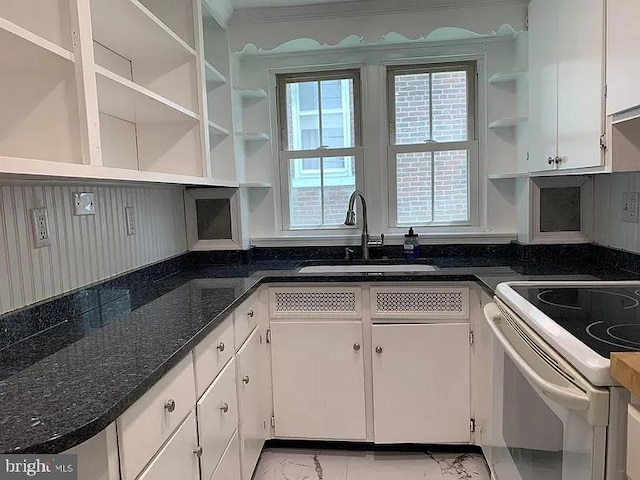 110 Chestnut St, Pottstown, PA 19464 - kitchen with open shelves, electric stove, and white cabinetry