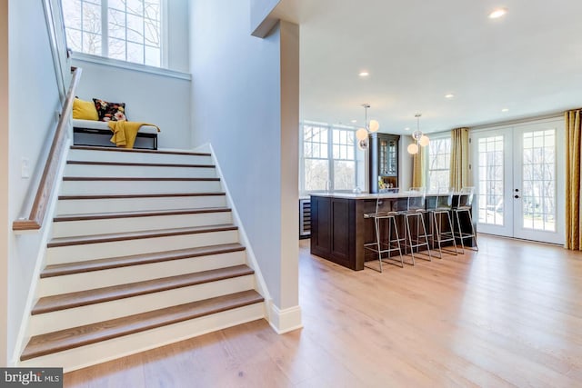 Lot1 Nathan Hale, Berwyn, PA 19312 - stairs featuring wood finished floors, recessed lighting, wine cooler, french doors, and bar