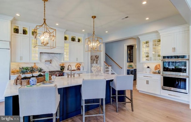 Lot1 Nathan Hale, Berwyn, PA 19312 - kitchen with double oven, a chandelier, white cabinetry, recessed lighting, and light wood finished floors