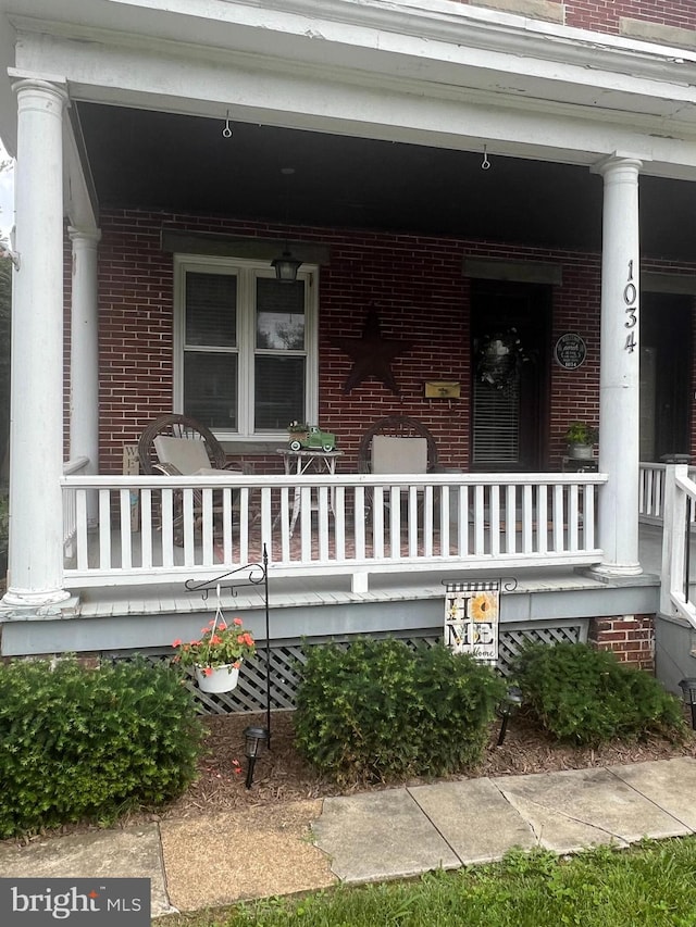 1034 Hamilton Blvd, Hagerstown, MD 21742 - property entrance with covered porch and brick siding
