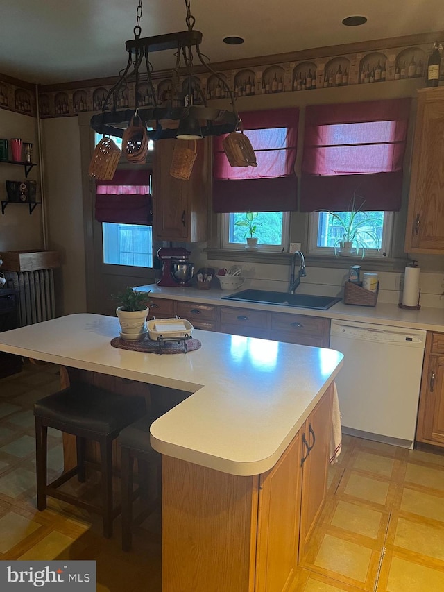1034 Hamilton Blvd, Hagerstown, MD 21742 - kitchen with dishwasher, light countertops, light flooring, a center island, and a breakfast bar area