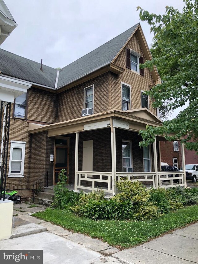 2450 N 6th St, Harrisburg, PA 17110 - view of front facade with a porch and brick siding