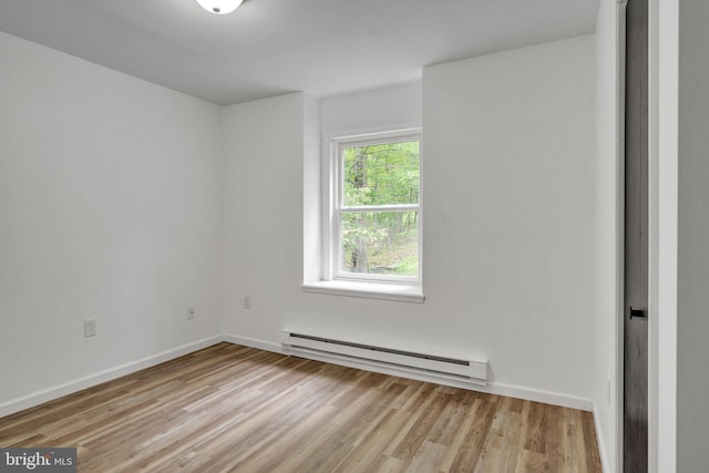 121 Almond Ct, Milford, PA 18337 - spare room featuring a baseboard radiator and light wood-style floors