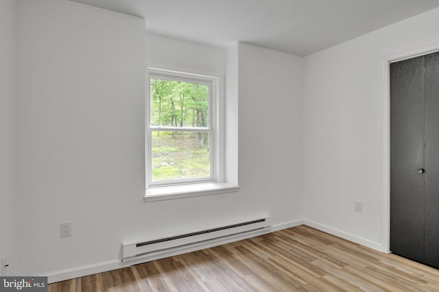 121 Almond Ct, Milford, PA 18337 - unfurnished bedroom with a baseboard heating unit, light wood-style floors, and a closet